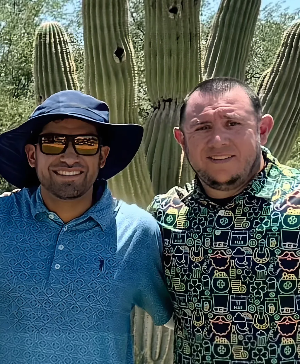 Bobby and Adrian standing together outdoors.